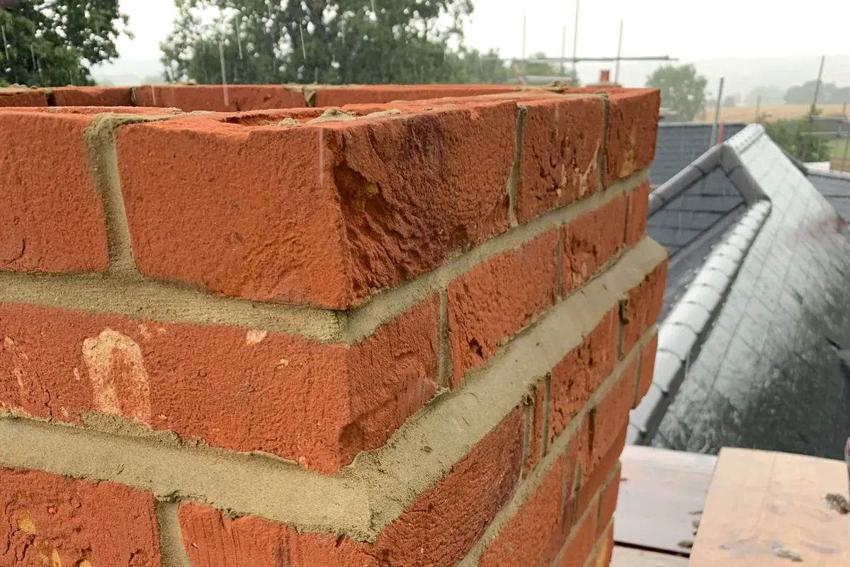 Close view of chimney stack rebuilt around a new stainless steel flue liner in Canterbury